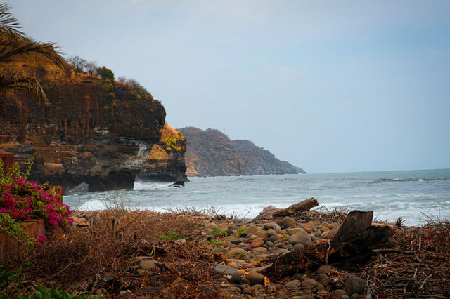 Rocky coast and beach with ocean views.