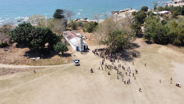 Aerial view of a church gathering by Lake Malawi in Nkhotakota, Central Region.