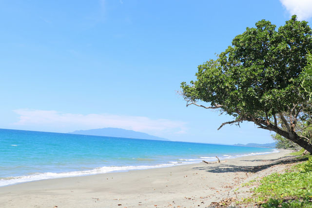 The blue island in the background is Kairuru Island. This was taken in on the beach in front of the Dagua Health Centre in East Sepik Province, Papua New Guinea.