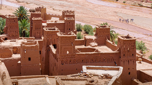 Explore this ancient clay fortress nestled in a stunning desert landscape, offering a glimpse into historical architecture.