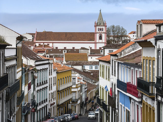 View of the vibrant streets and historic architecture of Angra do Heroísmo, a UNESCO site in the Azores.