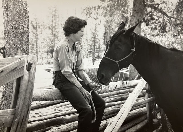 Mary Jane McDowell in uniform with a horse