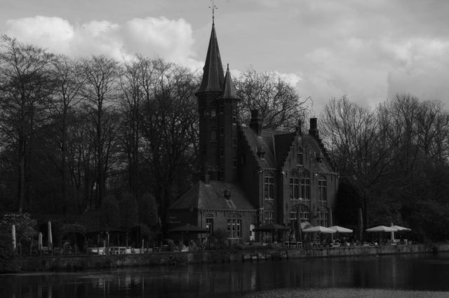 Historic brick house beside the water in Bruges, Belgium.