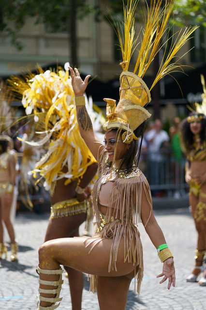 A line of dancers holding the road — the Paris tropical carnival