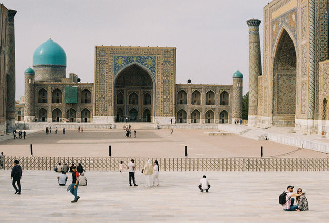 a group of people standing in front of a building