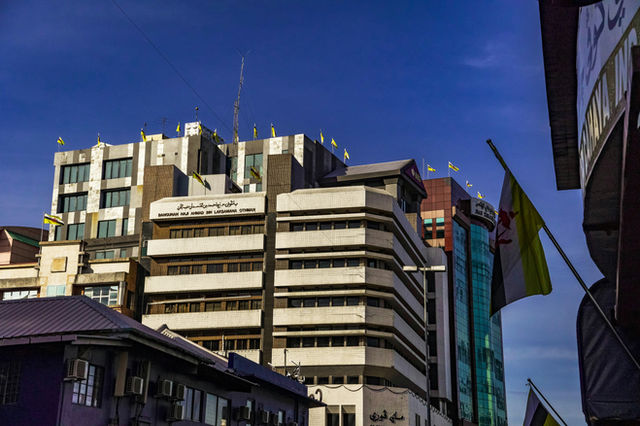 a large building with a lot of windows on top of it