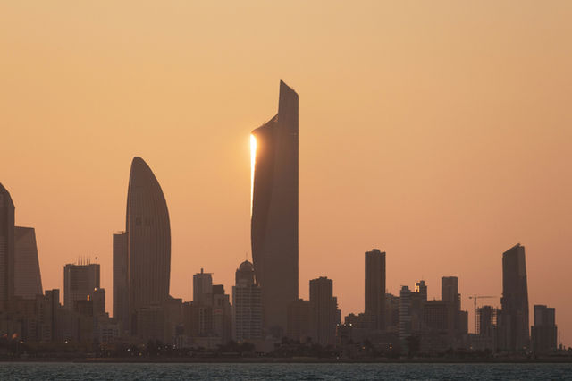 city skyline during sunset with city skyline in the distance