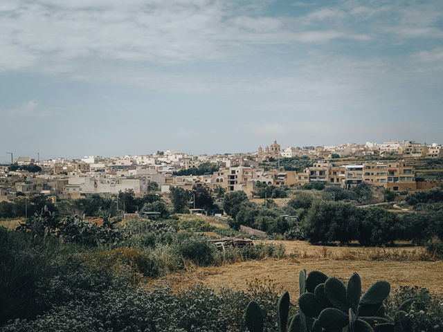 a view of a city from a hill