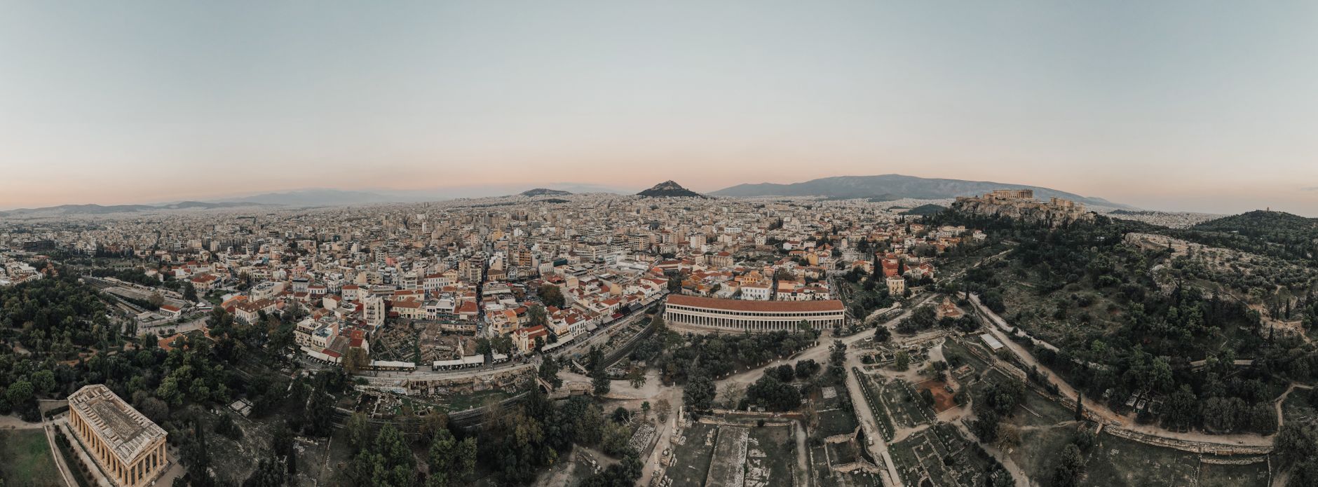 The Parthenon on the Athens Acropolis with Santorini's caldera and a Naxos beach — a 7-day Greece itinerary
