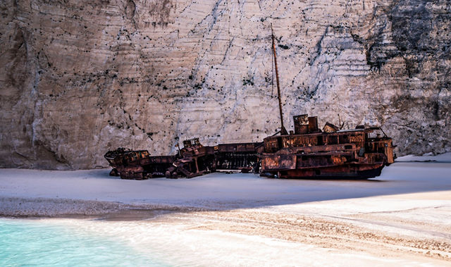 Explore the iconic shipwreck on Navagio Beach, Zakynthos, Greece, surrounded by dramatic cliffs and turquoise waters.