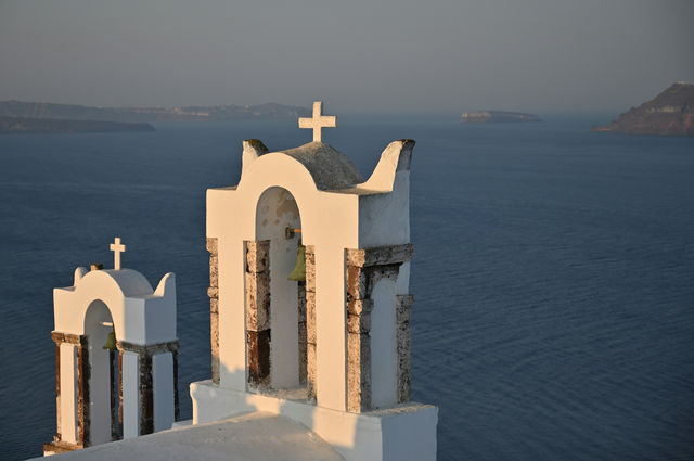 White church bell towers overlooking the ocean