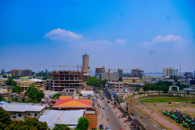 City skyline with buildings and a stadium