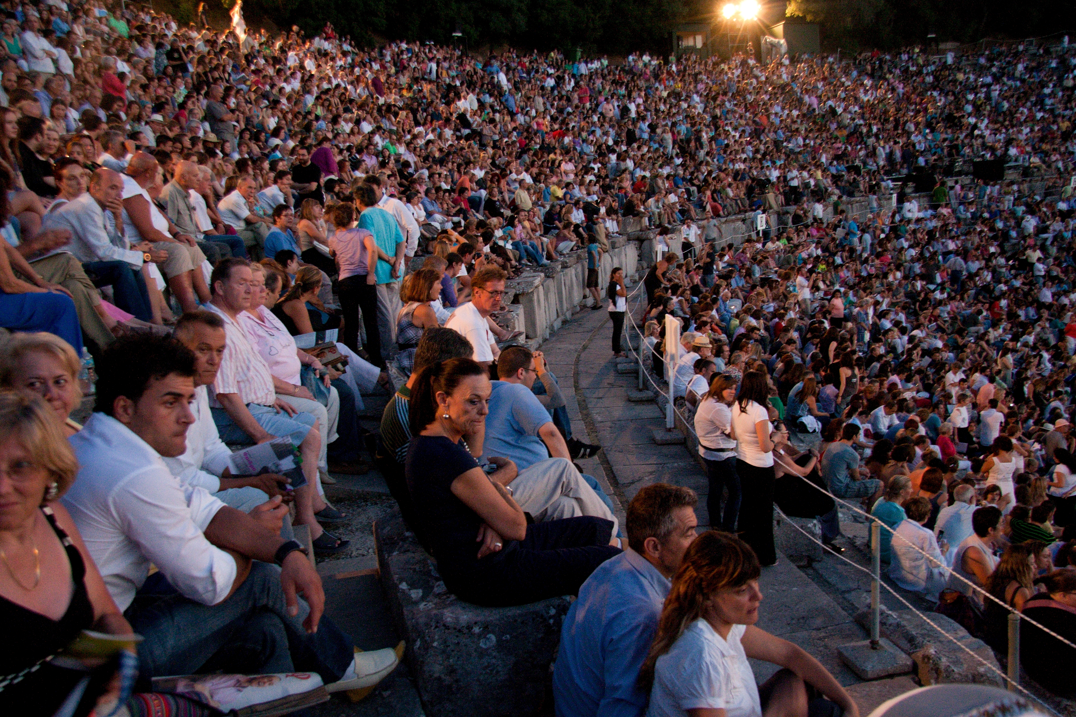 Spectators filling the Theatre of Epidaurus for a performance