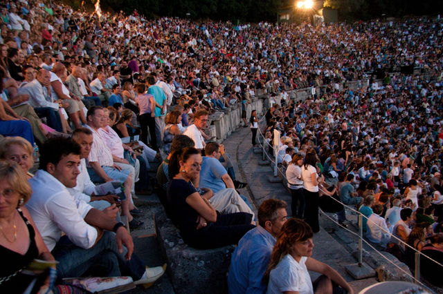 Spectators filling the Theatre of Epidaurus for a performance
