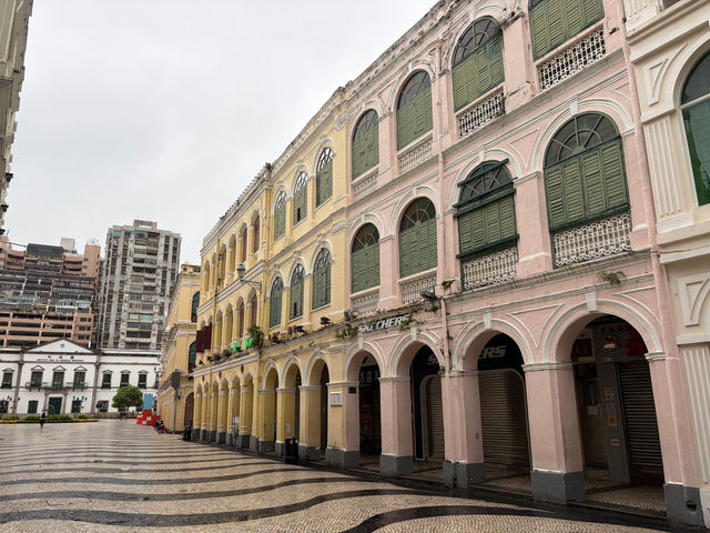 Charming pastel-colored colonial buildings in Macao's historic district.