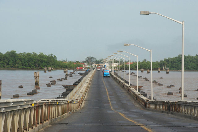 gray concrete bridge over river during daytime