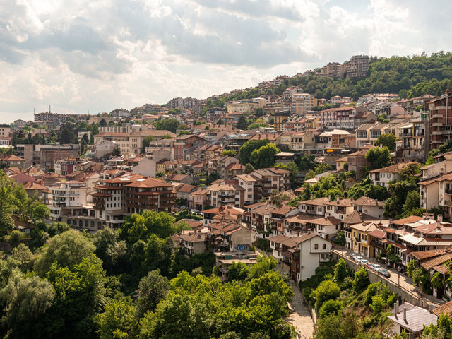 A picturesque aerial view of Veliko Tarnovo, Bulgaria, showcasing its unique architecture and lush greenery.