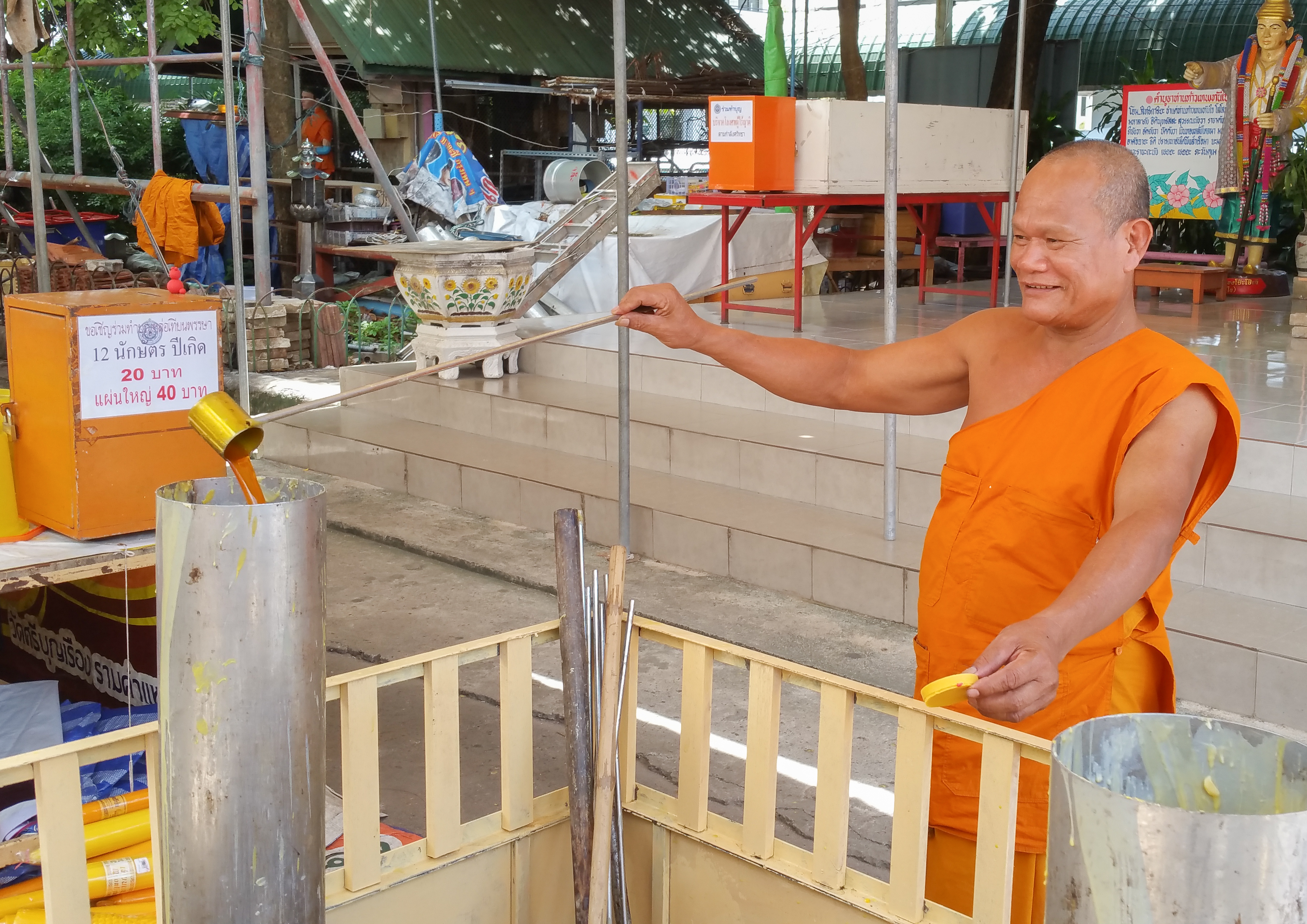 Monk making a candle (Khao Phansa candle tradition)