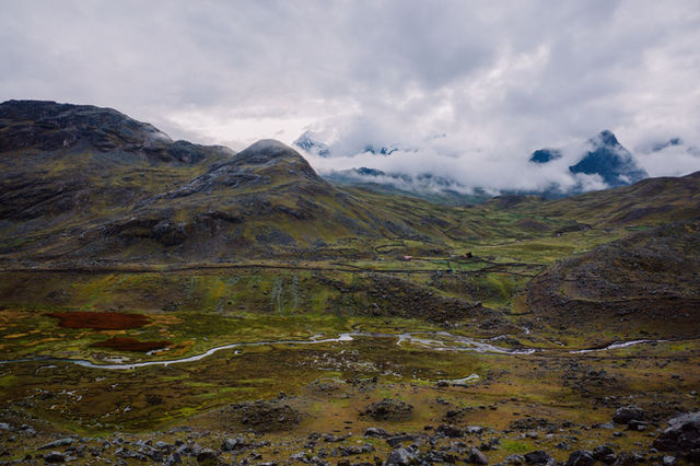 Stunning mountain landscape in Pajchanta, Peru, showcasing rolling hills and clouds.