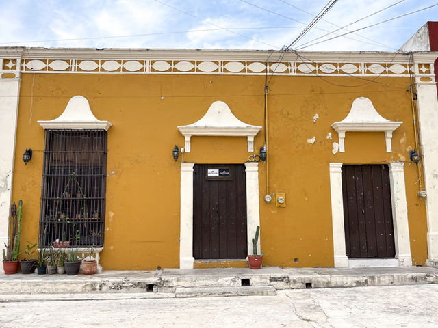 Colonial architecture in San Francisco de Campeche. Vibrant orange facade with Mexican charm.