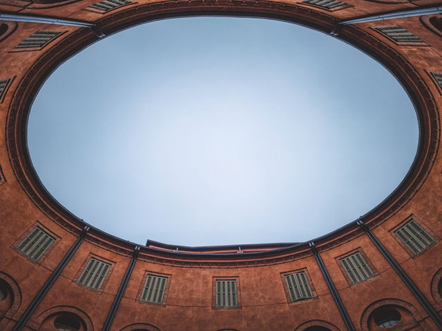 Beautiful low angle view of the Rotonda Foschini in Ferrara showcasing its unique architecture and open sky.