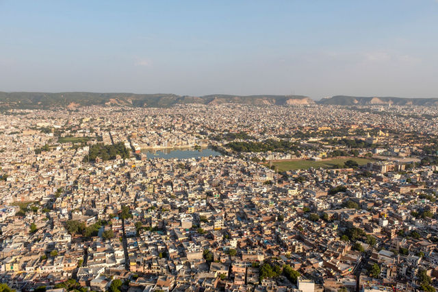 Panoramic aerial view of Jaipur, showcasing urban landscape and architectural heritage.