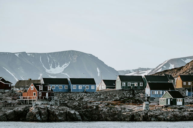 In this remote Arctic settlement paint for the houses is subsidised by the government in 3 standard colours - orange, red and blue. All other colours are not subsidised and usually represents families