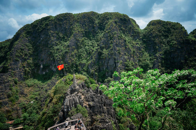 Jagged limestone karst mountains with lush green foliage