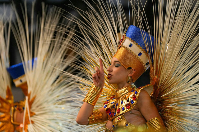 Mid-gesture in an Egyptian-themed costume