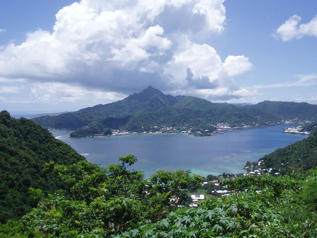 The eroded shield volcano of Pago at Pago Pago Harbor on Tutuila Island, American Samoa. The mountain summit (Matafao Peak) and upper slopes are a volcanic plug of trachyte (about