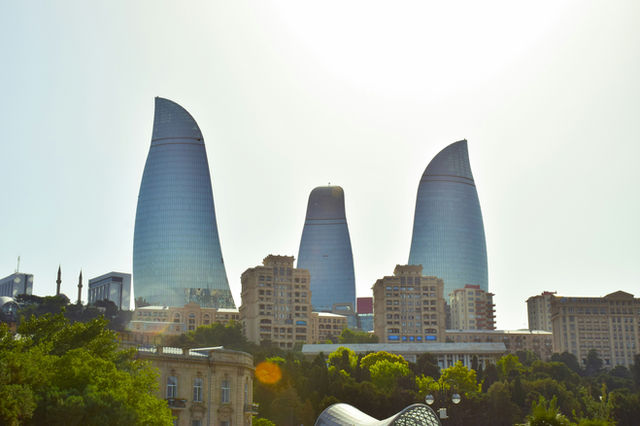 a group of tall buildings sitting next to each other