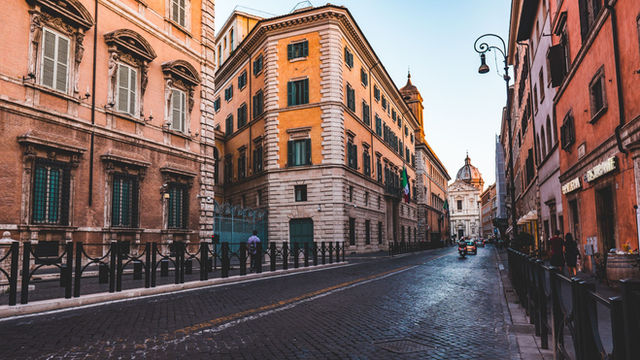 A picturesque street scene in Rome showcasing classic Italian architecture.