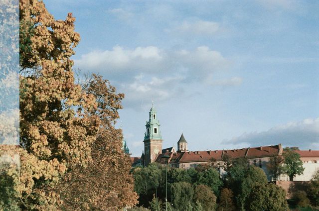 Castle with autumn trees and blue sky