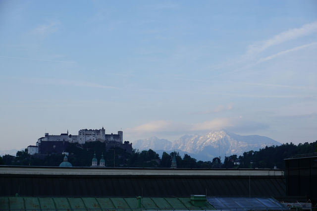 Hohensalzburg fortress on a hill with mountains behind