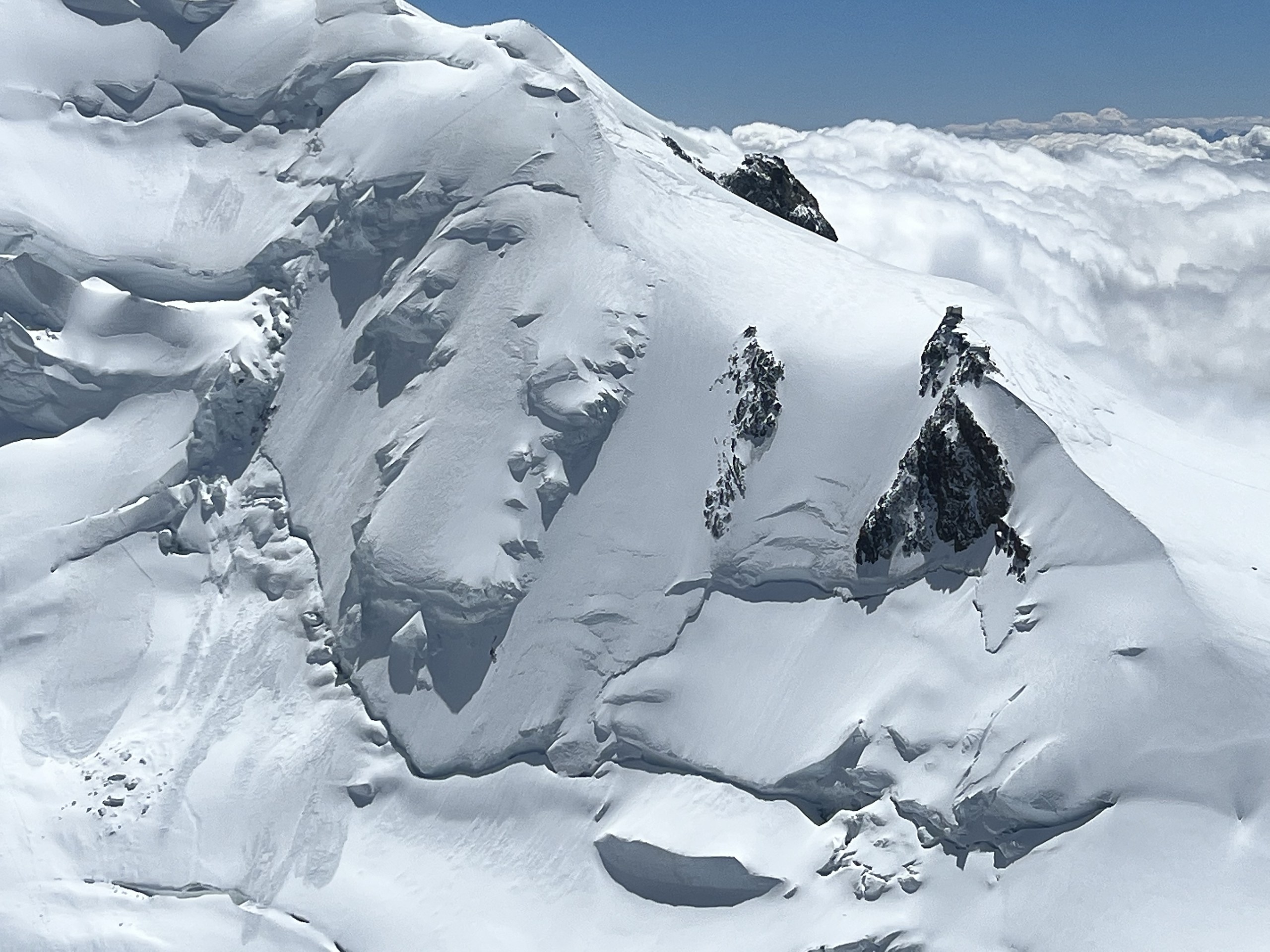 Snowfields and ridgelines of the Chamonix massif seen from above