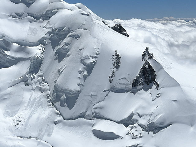 Snowfields and ridgelines of the Chamonix massif seen from above