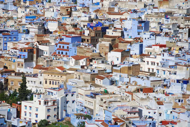 Stunning aerial view of the iconic blue city Chefchaouen, showcasing intricate architecture and vibrant colors.