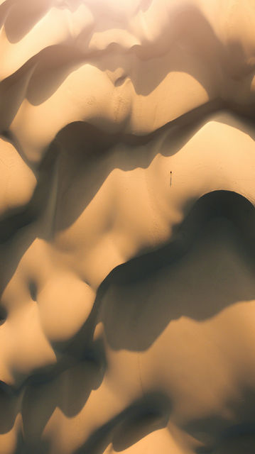a view of a desert with sand dunes
