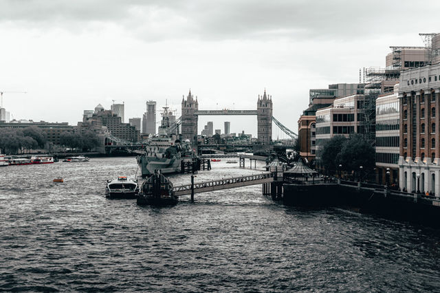 A captivating view of London's skyline featuring Tower Bridge and the bustling River Thames.