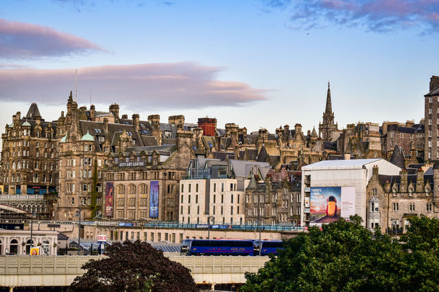Picturesque view of Edinburgh's historic skyline featuring the City Art Centre at sunset.