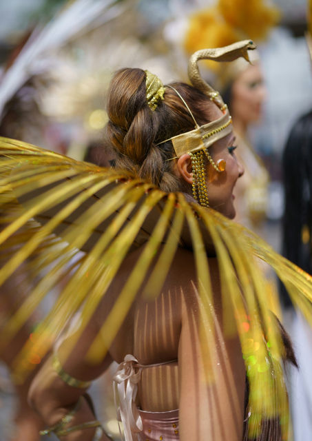 Feathers stacked shoulder-high — the Paris tropical carnival