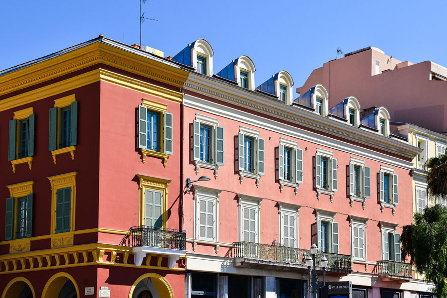 Elegant building in Nice, France, featuring classic French architecture with colorful facades.