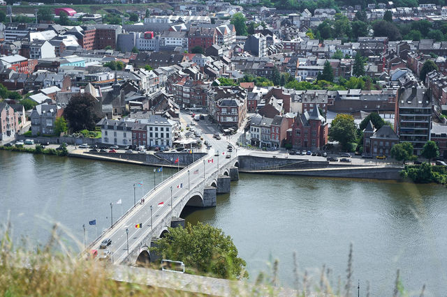 Explore a stunning aerial view of Namur, Belgium, showcasing Jambes Bridge over the Meuse River.
