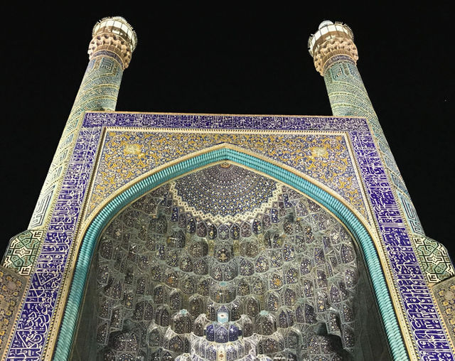 Mesmerizing view of the Jameh Mosque in Isfahan, showcasing its intricate tilework and architectural beauty at night.