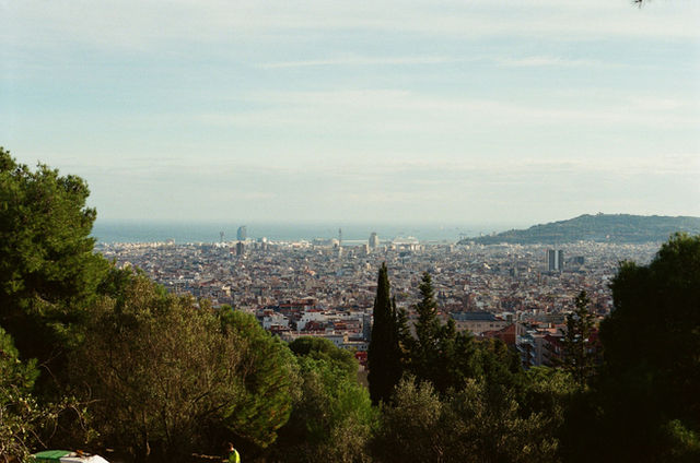 Panoramic view of a sprawling city with ocean in background