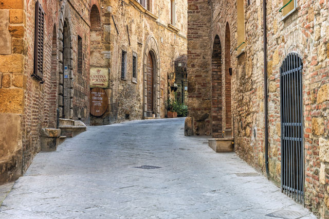 Scenic view of a quaint old alley in Montepulciano's historic district, Tuscany.