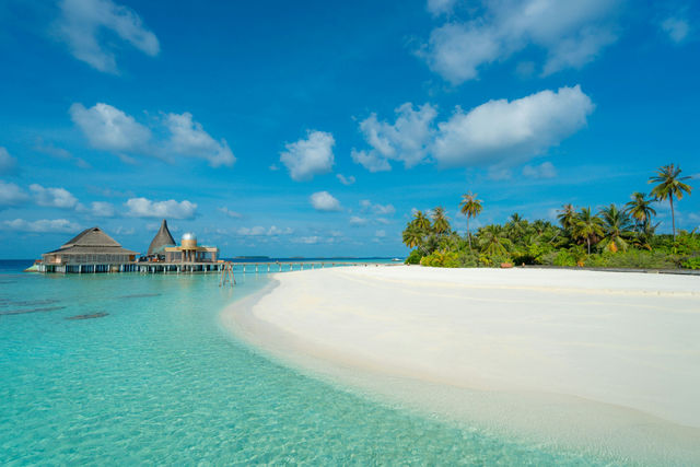 The white sandy beach near the spa at Anantara Kihavah Maldives Villas in Baa Atoll, Maldives.