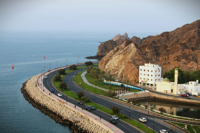 An aerial view of a highway near a body of water