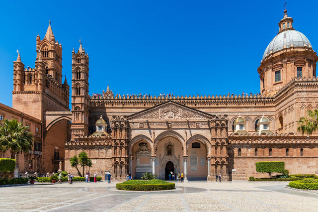 Explore the stunning architecture of Palermo Cathedral on a sunny day in Sicily.