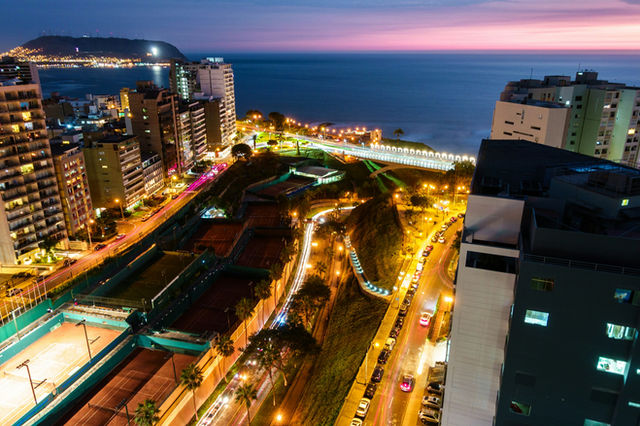 city with high rise buildings during night time